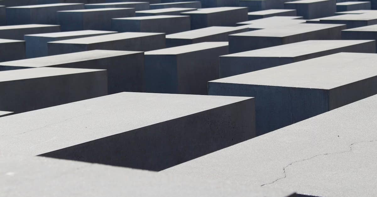 Abstract view of Berlin's Holocaust Memorial concrete blocks, evoking history and reflection.